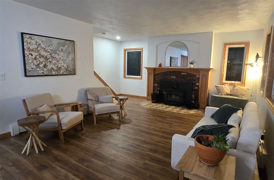 Living room with new LVP flooring installed for Jessica